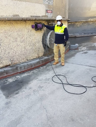Technician performing ultrasonic testing at Tasiast